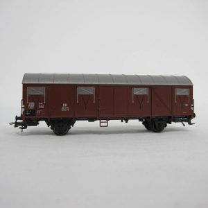 Brown long goodswagon silver roof