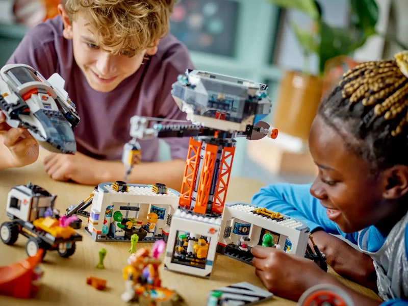 Kids playing with LEGO City 60434 - Space Base and Rocket Launchpad