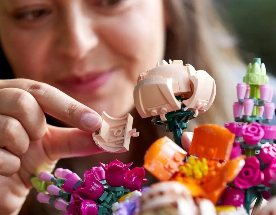 Woman building LEGO Flower Bouquet